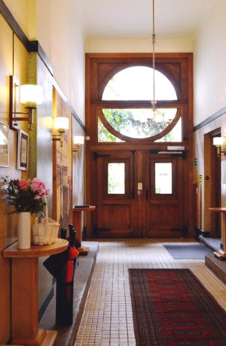 a lobby with a large wooden door with a window at Chopin Boutique in Warsaw