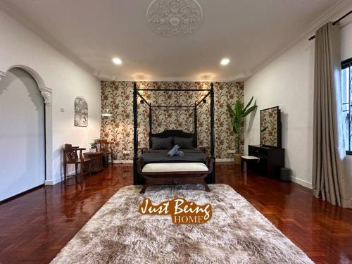 a bedroom with a bed and a rug in a room at Just Being Home 10pax 3BR/3BA 4Queen/1Sofa in Ampang