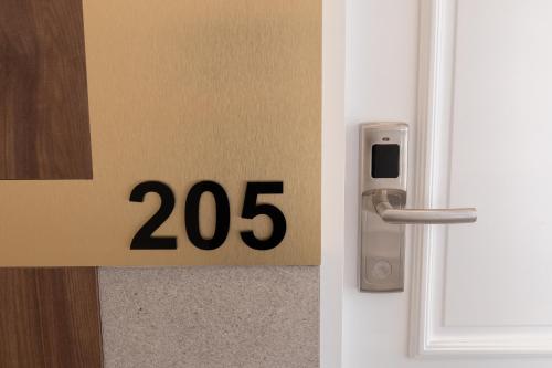 a door with the number on it and a door knob at RIVA sleep & chill in Valjevo