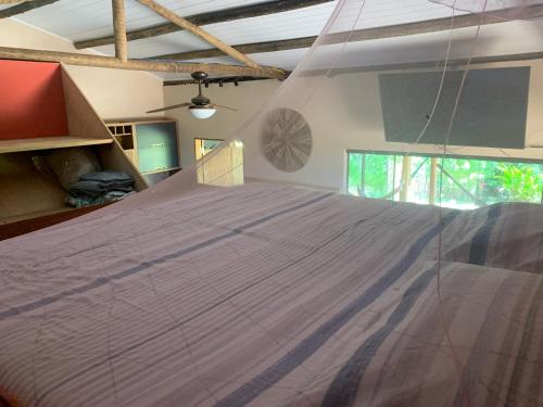 Postel nebo postele na pokoji v ubytování La Maison Cocobanana