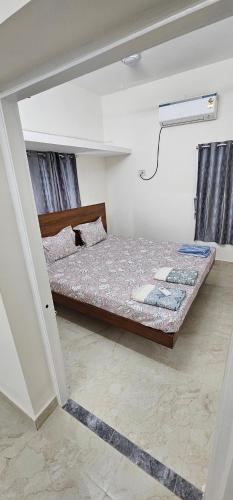 a bedroom with two beds in a room at HOMESTAY - AC 3 BHK NEAR AlRPORT in Chennai