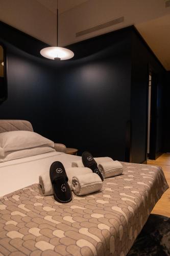 a bedroom with a bed with towels on it at Axis Porto Club Aliados in Porto