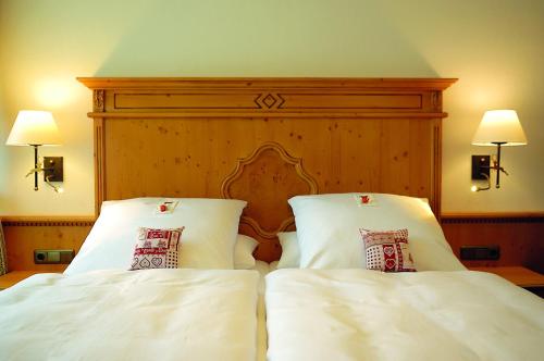 Katil atau katil-katil dalam bilik di Hotel Alpenhof - ruhige Wohlfühloase zwischen München, dem Fünf-Seenland und den Bergen, in S-Bahnnähe