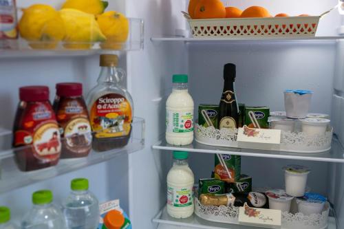 a refrigerator filled with lots of food and drinks at B&B Carpe Diem in Castel Gandolfo
