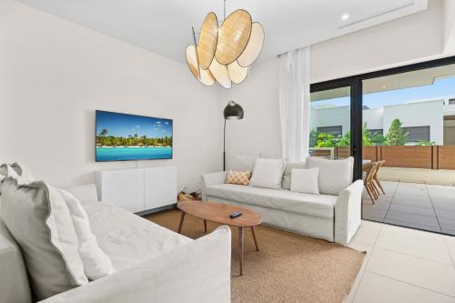 a living room with white furniture and a tv at Stunning Apt in Mijas by Costarentals - Ref 235 in Mijas Costa