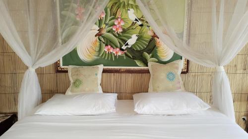 Ένα ή περισσότερα κρεβάτια σε δωμάτιο στο Embang Homestay