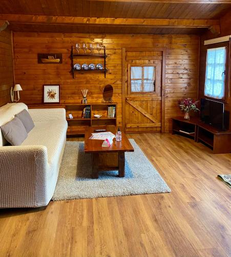 a living room with a bed and a coffee table at Agroturismo Anziola in Oiartzun