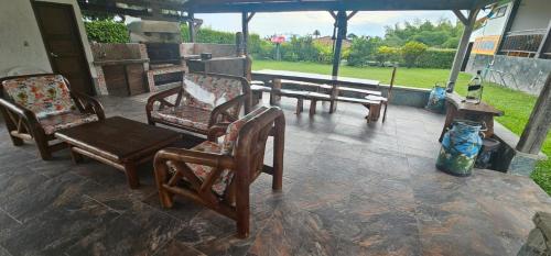 a group of chairs and tables on a patio at PUENTE IGLESIA in Montenegro