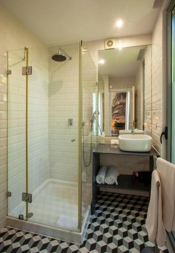 a bathroom with a shower and a sink at Casa Vela Boutique House in Cascais