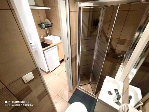 a bathroom with a shower and a toilet and a sink at T5 Apartment with terrace and sun next the metro T5 in Barcelona