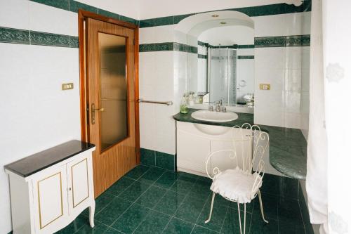a bathroom with a sink and a mirror at Appartamento Venere e Adone in Sulmona