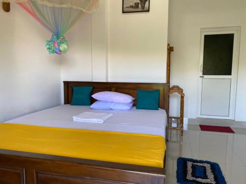 a bedroom with a bed in a room at Wild Bee Safari Lodge in Udawalawe