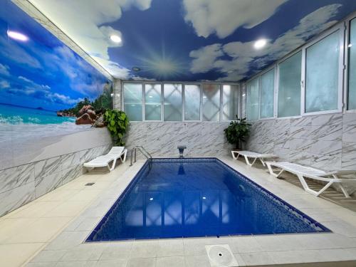 a swimming pool with a view of the ocean at Sea Pearl Hotel in Baku