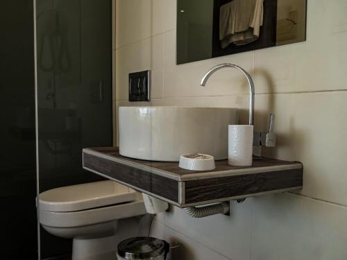 a bathroom with a sink and a toilet at Lido Star in Faliraki