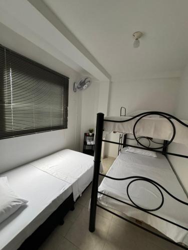 Кровать или кровати в номере Apartamento amoblado para familia y amigos