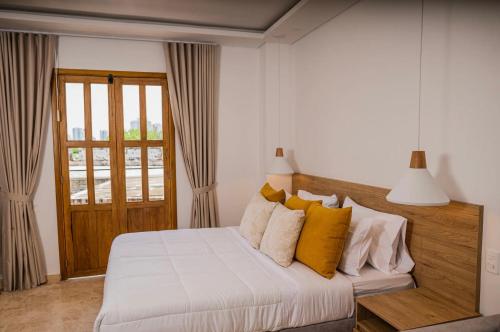 Ένα ή περισσότερα κρεβάτια σε δωμάτιο στο Del Mar Guest House