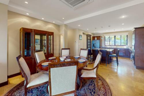 a dining room with a wooden table and chairs at Azul Paraíso 2B in Ocotal