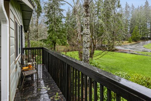 a porch with a bench and a tree on a house at Un-Fore-gettable in Union