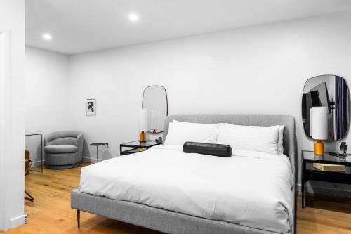 a bedroom with a bed with a tv on it at The Phenix Historic DTWN Hotel, King Bed, Room # 311 in Bangor