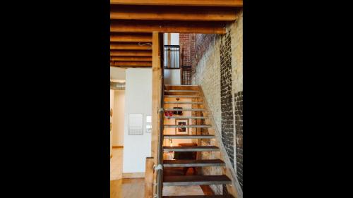 a ladder leading up to a room with a brick wall at The Icon in Springfield