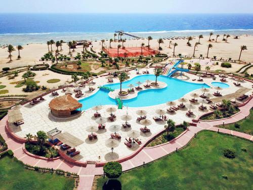 an aerial view of a swimming pool at a resort at Bliss Nada Beach Resort in Coraya Bay