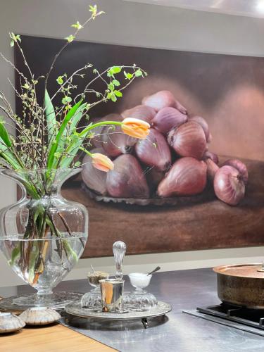 a painting of a bowl of onions on a wall at bed,Beet&breakfast „ds aute Pfarrhuus“ in Rapperswil