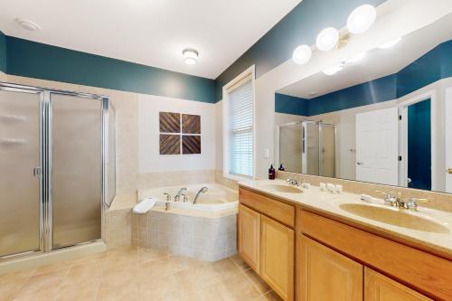a bathroom with two sinks and a shower at Pine Crest in Pocono Pines
