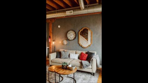 a living room with a couch and a table at Broken Clock in Springfield