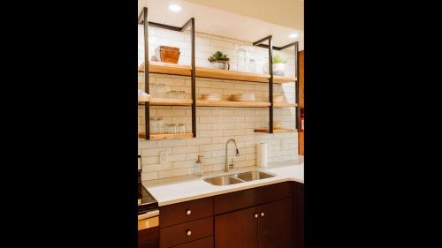 a kitchen with a sink and a counter at Broken Clock in Springfield