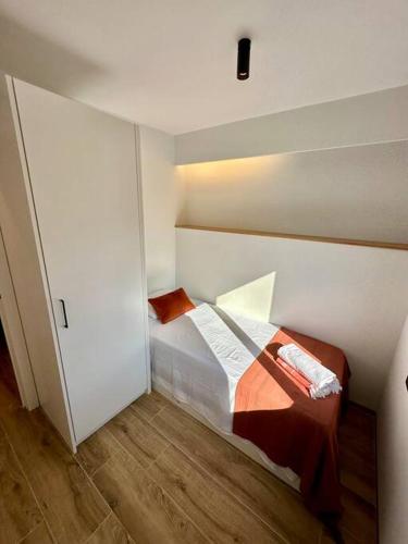 a bedroom with a bed in a room at Apartamento Moderno con gran terraza" GREGAL" in Port de Soller