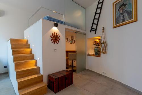 a staircase in a home with a stair case at Residence Agape in Cefalù