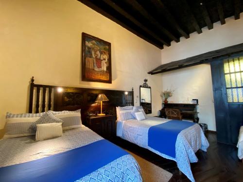 Postel nebo postele na pokoji v ubytování Hotel Mansion Iturbe