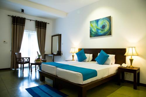 Postelja oz. postelje v sobi nastanitve Coco Royal Beach Resort Pvt Ltd