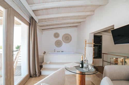 a living room with a couch and a table at Masseria Longa Boutique Hotel in Otranto