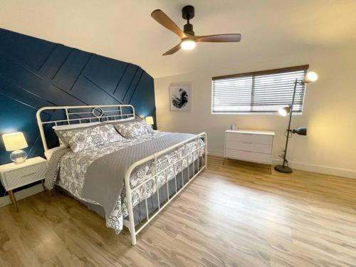 a bedroom with a bed and a ceiling fan at Spacious 1 bedroom less than 1 mile to Beach & DT in Huntington Beach
