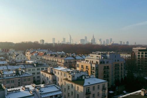 a group of buildings with a city in the background at Wawaview! Studio with an amazing view! Powiśle. in Warsaw