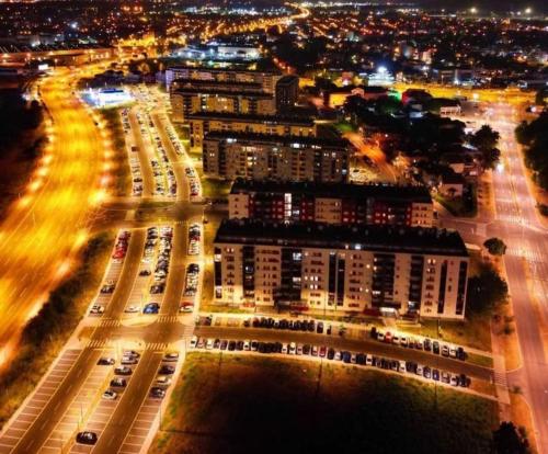 an overhead view of a parking lot at night at MoonZE apartman, free parking in Novi Grad