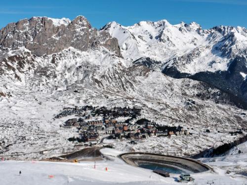 a ski resort in the middle of a snowy mountain at Oasis Pirineos in Formigal