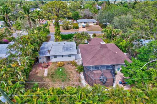 an overhead view of a house with a roof at Sunny Naples - Subtropical Oasis Cottage in Naples