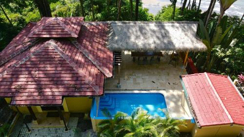 an overhead view of a house with a swimming pool at Villas by Tekoa in Uvita