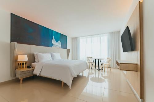 Postel nebo postele na pokoji v ubytování Radisson Blu Aruba