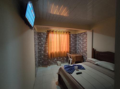 Postel nebo postele na pokoji v ubytování Alojamiento Oasis