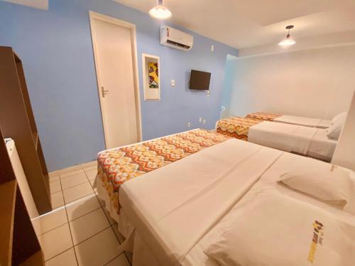 เตียงในห้องที่ Hotel Porto Salvador