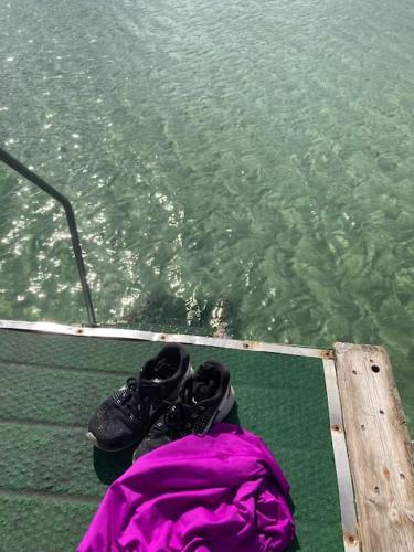 a pair of shoes sitting on the bow of a boat at Charming holiday home on the harbour (5 persons) in Rødvig