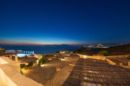 a view from the top of a building at night at Aegean Stones in Agios Ioannis Mykonos