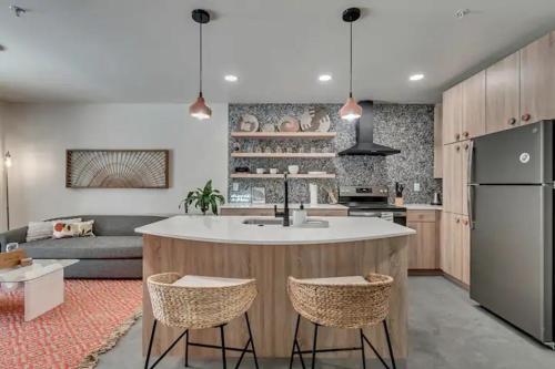 a kitchen with a large island in the middle of a room at Maven STAY in Salt Lake City