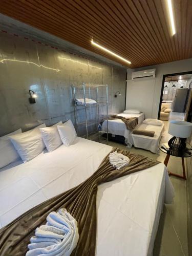 Katil atau katil-katil dalam bilik di Ypê Flats e Containers