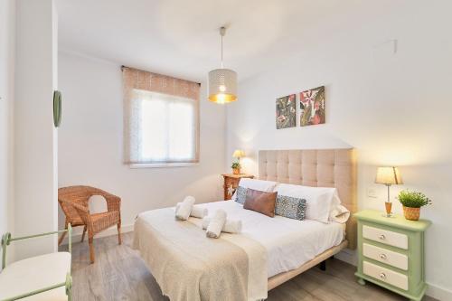 Posteľ alebo postele v izbe v ubytovaní Nice Apartment Huelin