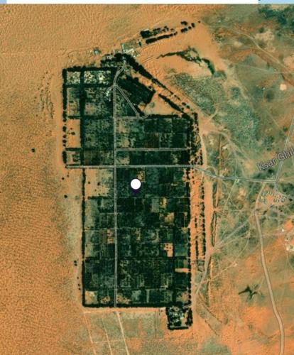 an aerial view of an island in the desert at Hotel Pansy in Ksar Ghilane