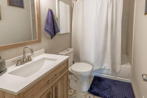 a bathroom with a sink and a toilet and a shower at Spacious Condo Close to Sphere in Las Vegas
